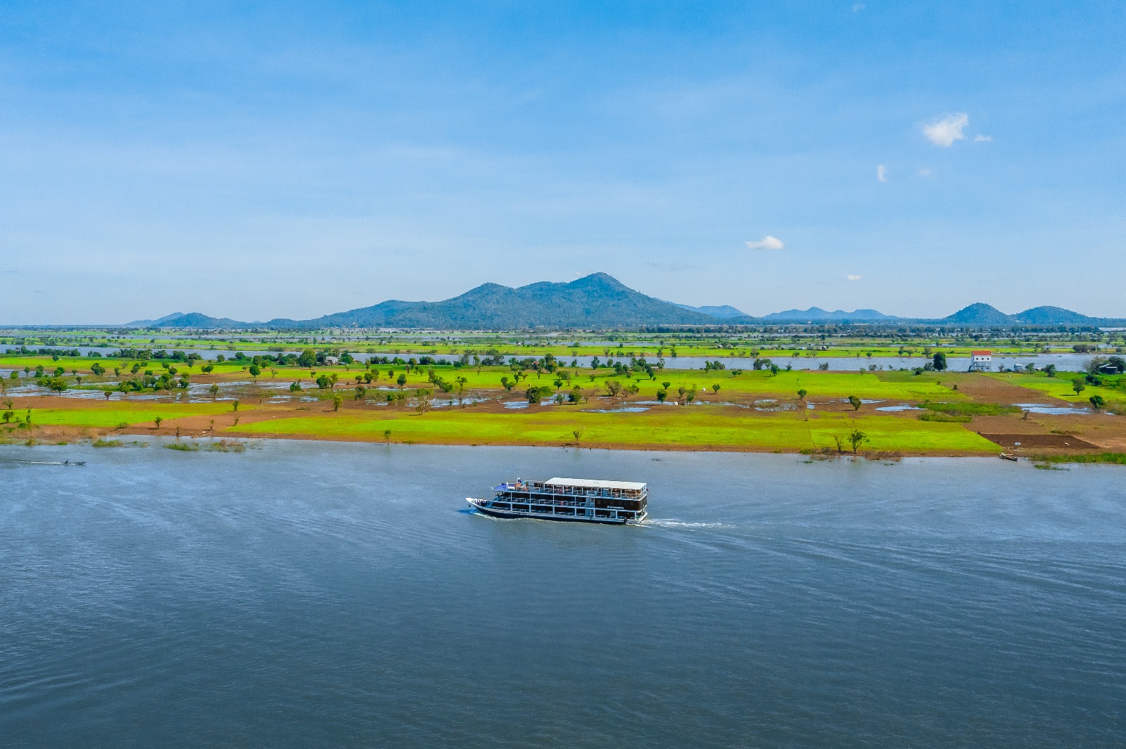 A luxury CroisiEurope river cruise ship on the Mekong River, traveling between Cambodia and Vietnam for private group charters.