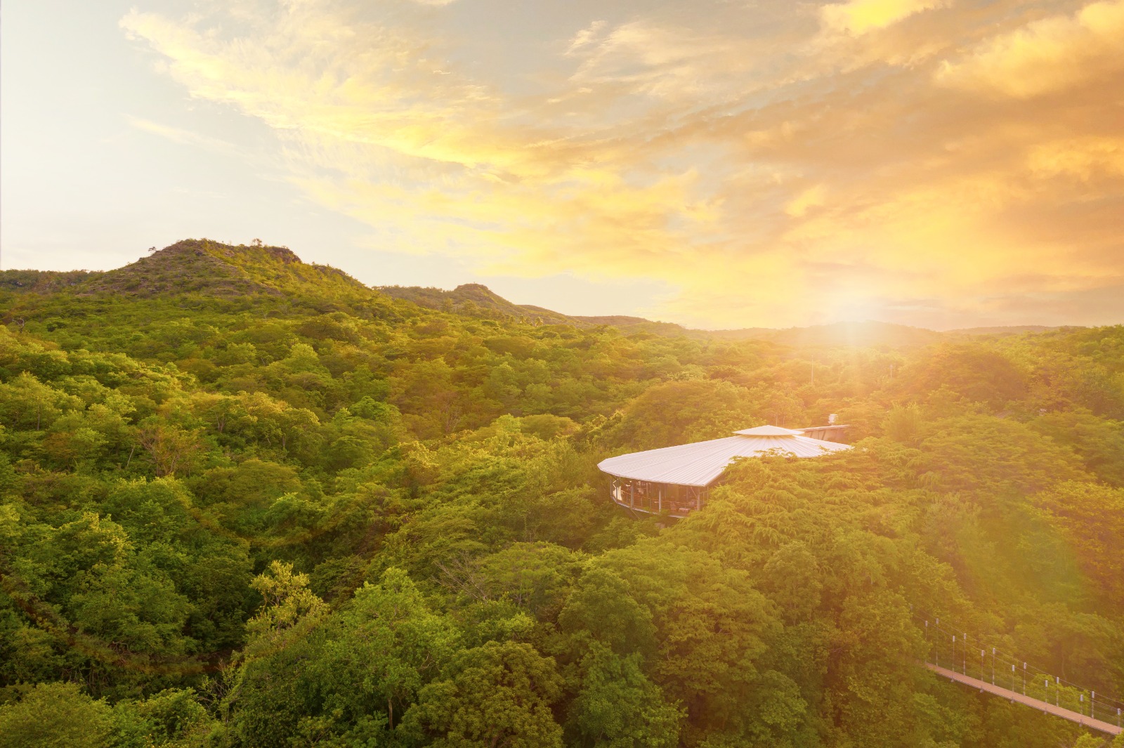 Thermal river and luxury eco-bungalows at Rio Perdido, Costa Rica, showing the exclusive sanctuary for adventure-seeking HNWIs.